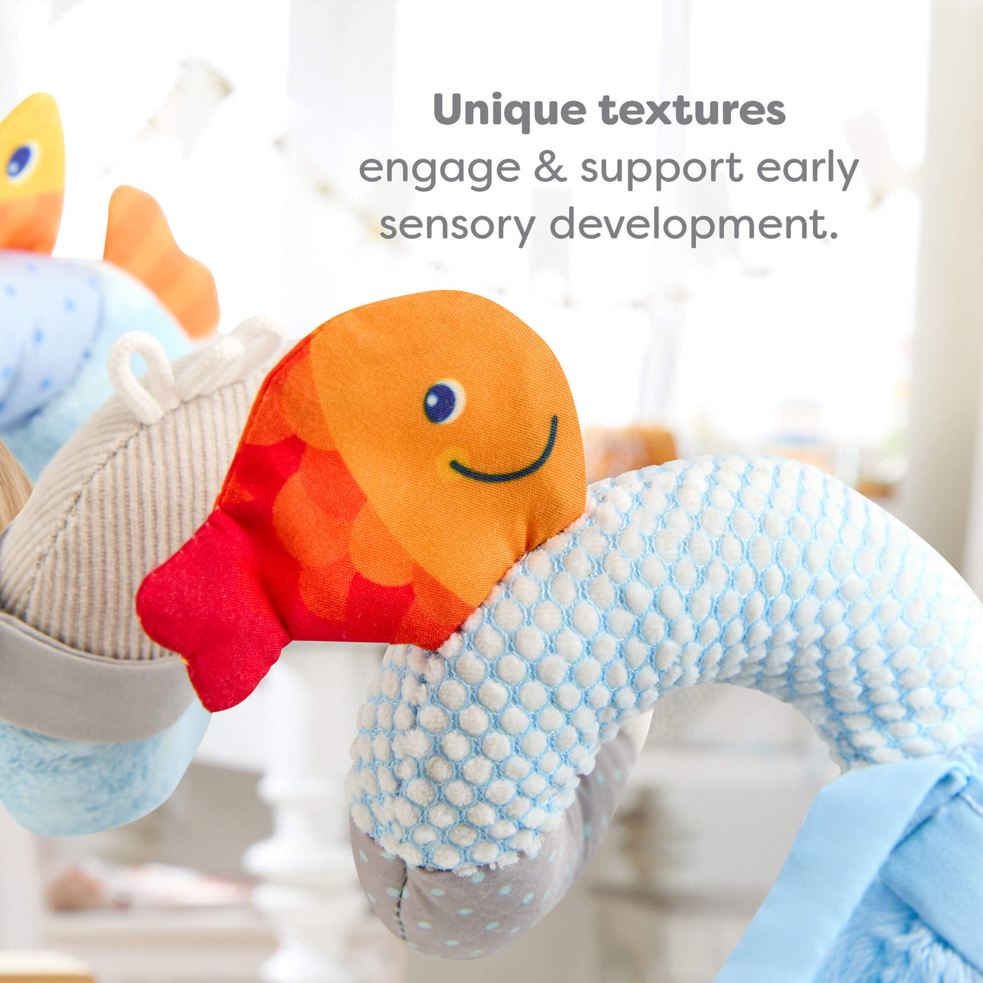 Close up of Penguin Activity Spiral fish, text reads 'Unique textures support early sensory development'