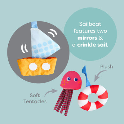 Penguin Activity Spiral features toy sailboat with mirrors and crinkle sail, plush octopus wit soft tentacles, and plush life buoy 