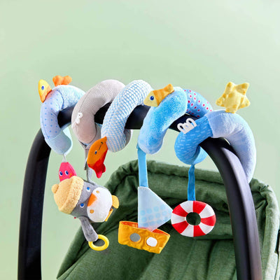 Penguin Activity Spiral Stroller & Car Seat Toy on a car seat.
