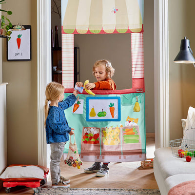 Children playing in HABA Hanging Doorway Play Store