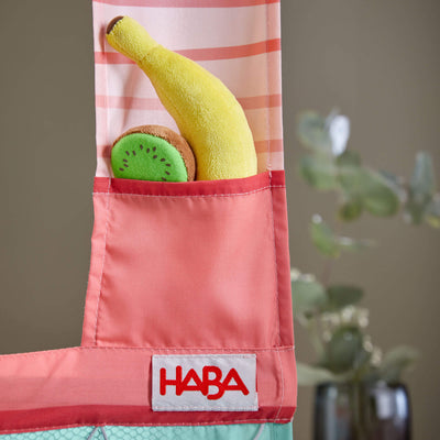 Play food fruits in pocket of HABA Hanging Doorway Play Store