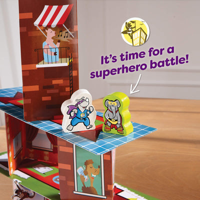 Close up of rhino and elephant game pieces on the Rhino Hero Super Battle card tower with the words "It's time for a superhero battle!"