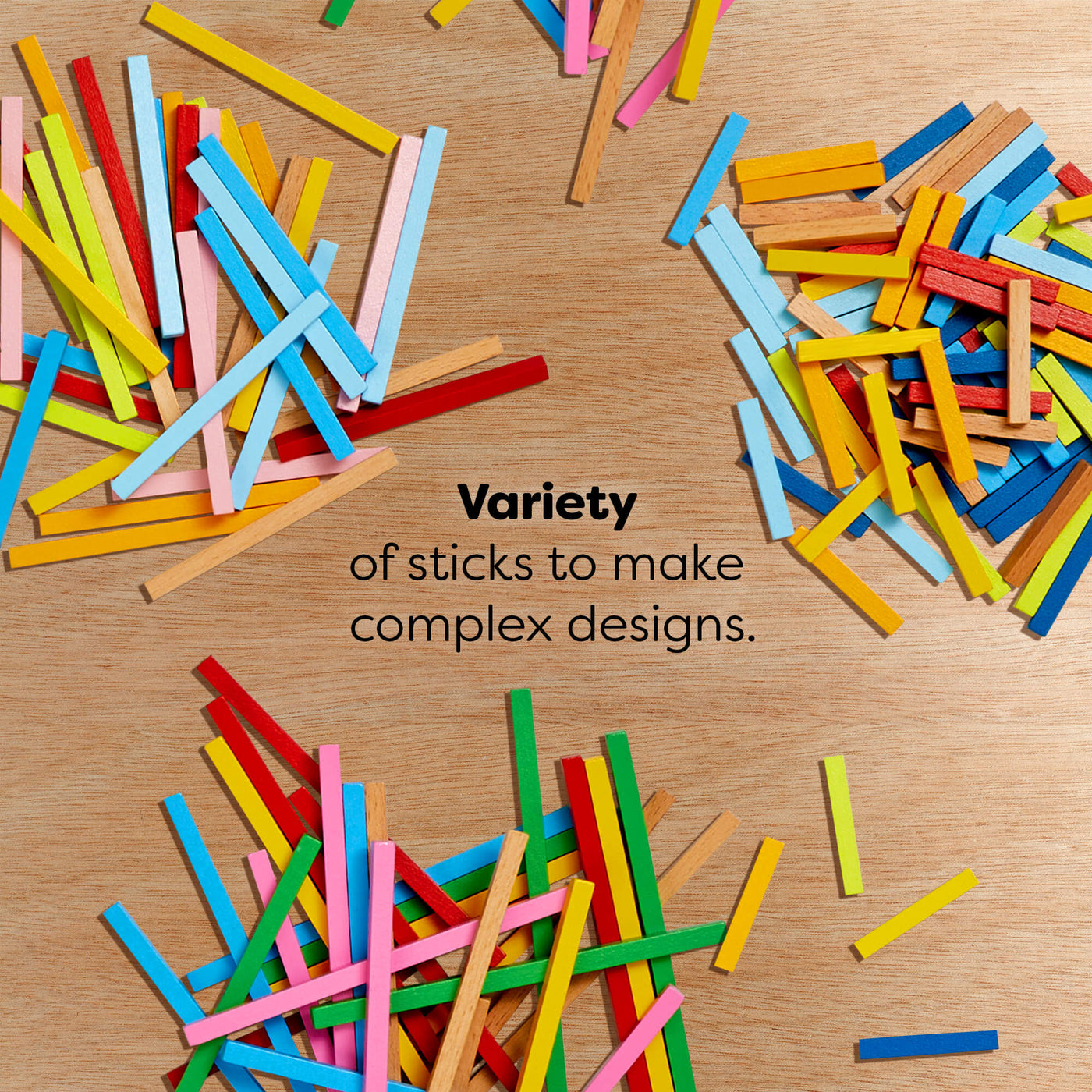 Colorful wooden sticks on a wooden surface with text reading "Variety of sticks to make complex designs."