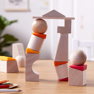 Teetering Towers Wooden Blocks - HABA USA wooden block tower on wooden table