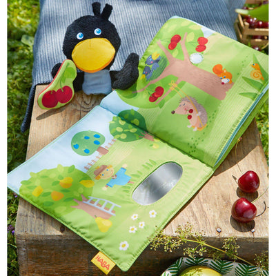 Orchard Fabric Baby Book with Raven Finger Puppet - HABA USA