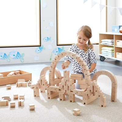 Child playing with HABA Interlocking Wooden Blocks Construction Set